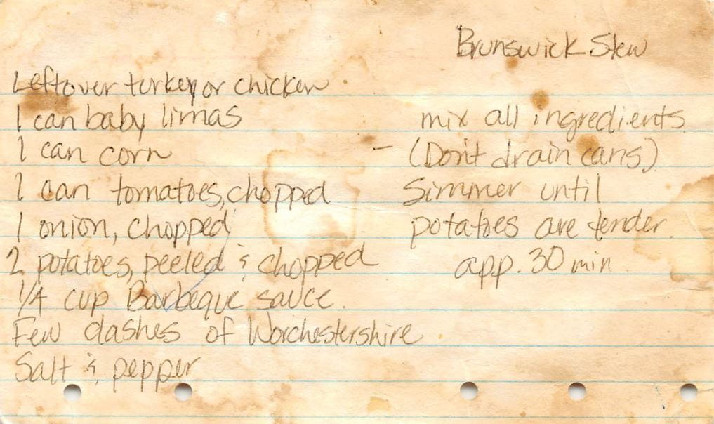 recipe for Brunswick Stew handwritten on a browned index card with five small binder holes at the bottom