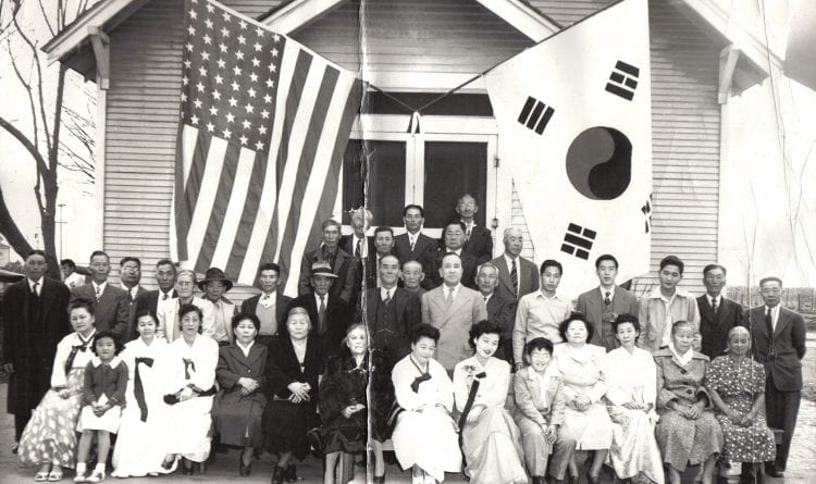 Korean men, women, and children in front of a church